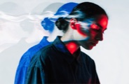 Campaign visual of a person in profile under azure light