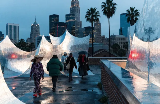 Campaign visual — rooftop crowd in cedar light