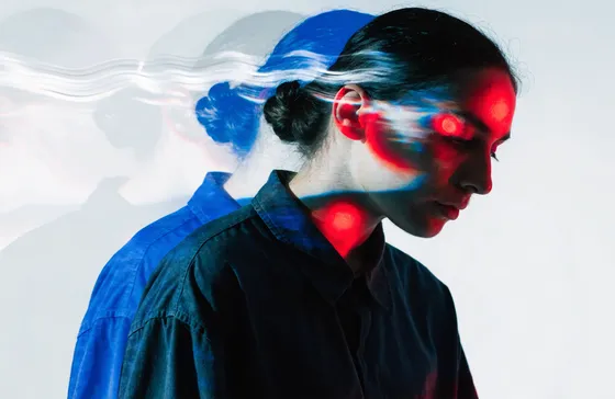 Campaign visual — portrait in azure projection light
